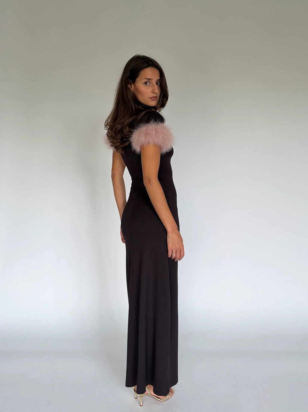 Back view of the SIENA chocolate maxi dress with a pale pink marabou feather sleeve
