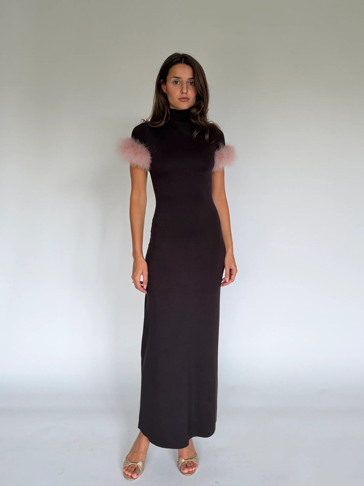 SIENA chocolate maxi dress with a high mock neck and pale pink marabou cuffs, front view